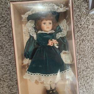 Charming Teal Porcelain Doll with Lace Details